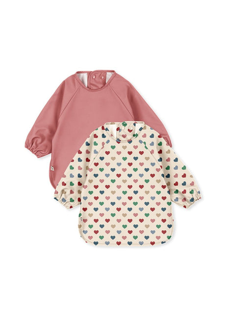 Slabbetjes Met Mouwen Coeure/Faded Rose 2st koop je bij Babywinkel